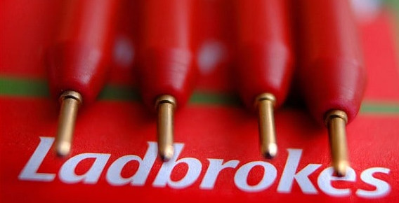 Ladbrokes Australia logo below four red pens